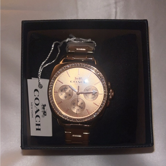 Women’s rose gold Coach watch
